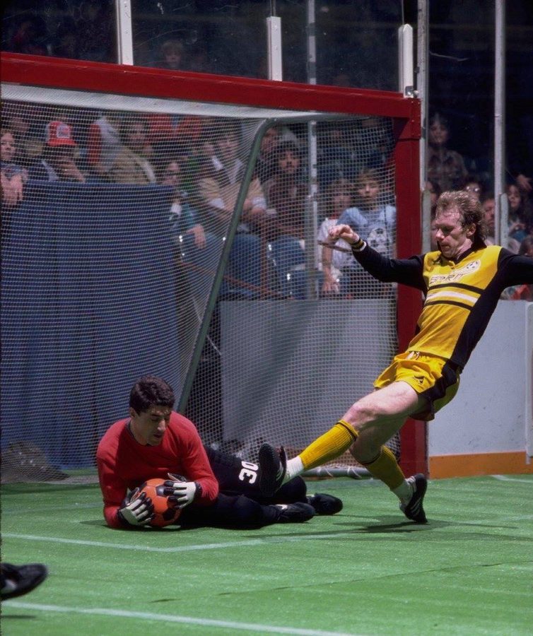 A Spirit forward shooting as the opposing goalkeeper smothers the ball at the near post