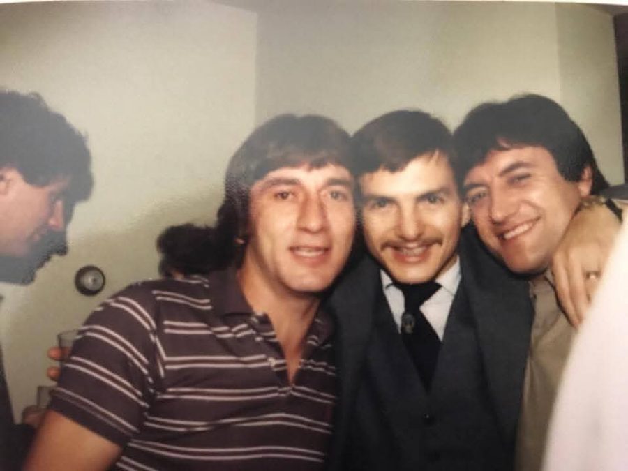 Three teammates together off the field